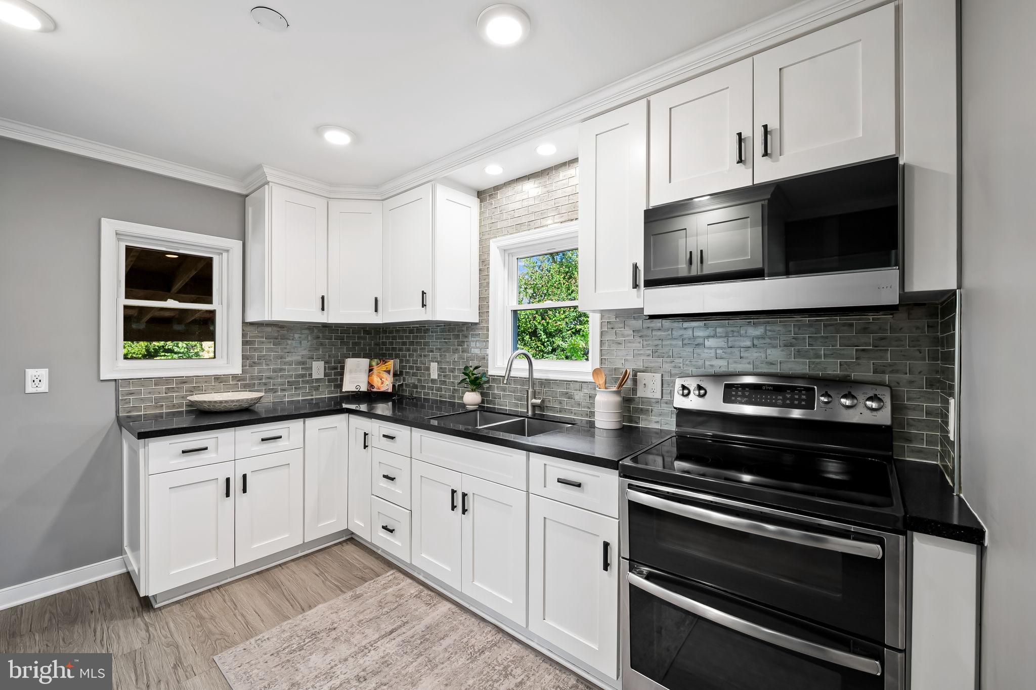 3332 Dublin Road Darlington, MD 21034 - Photo 12 of 39 a kitchen with granite countertop white cabinets and appliances