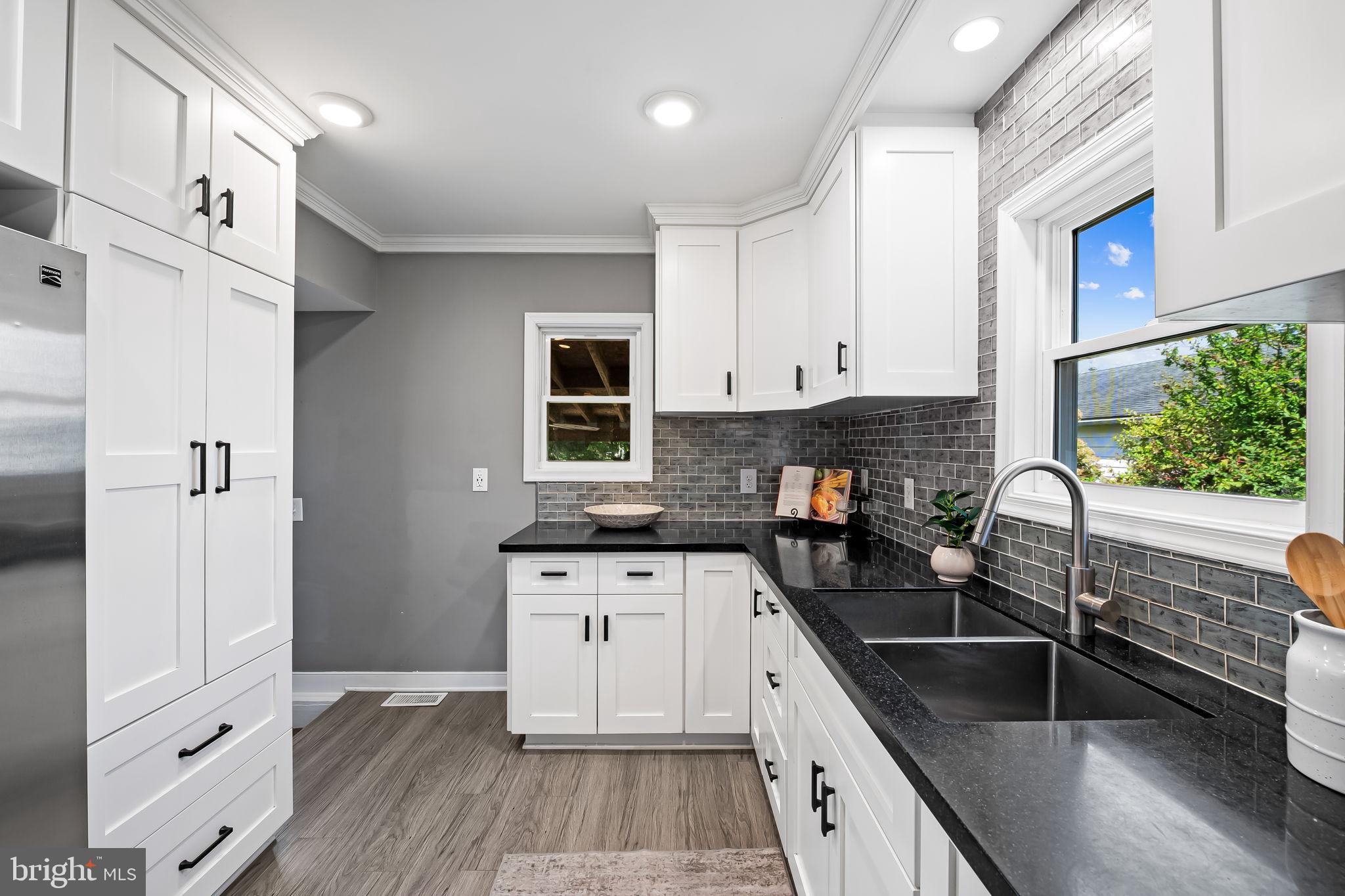 3332 Dublin Road Darlington, MD 21034 - Photo 13 of 39 a kitchen with granite countertop a stove sink and cabinets