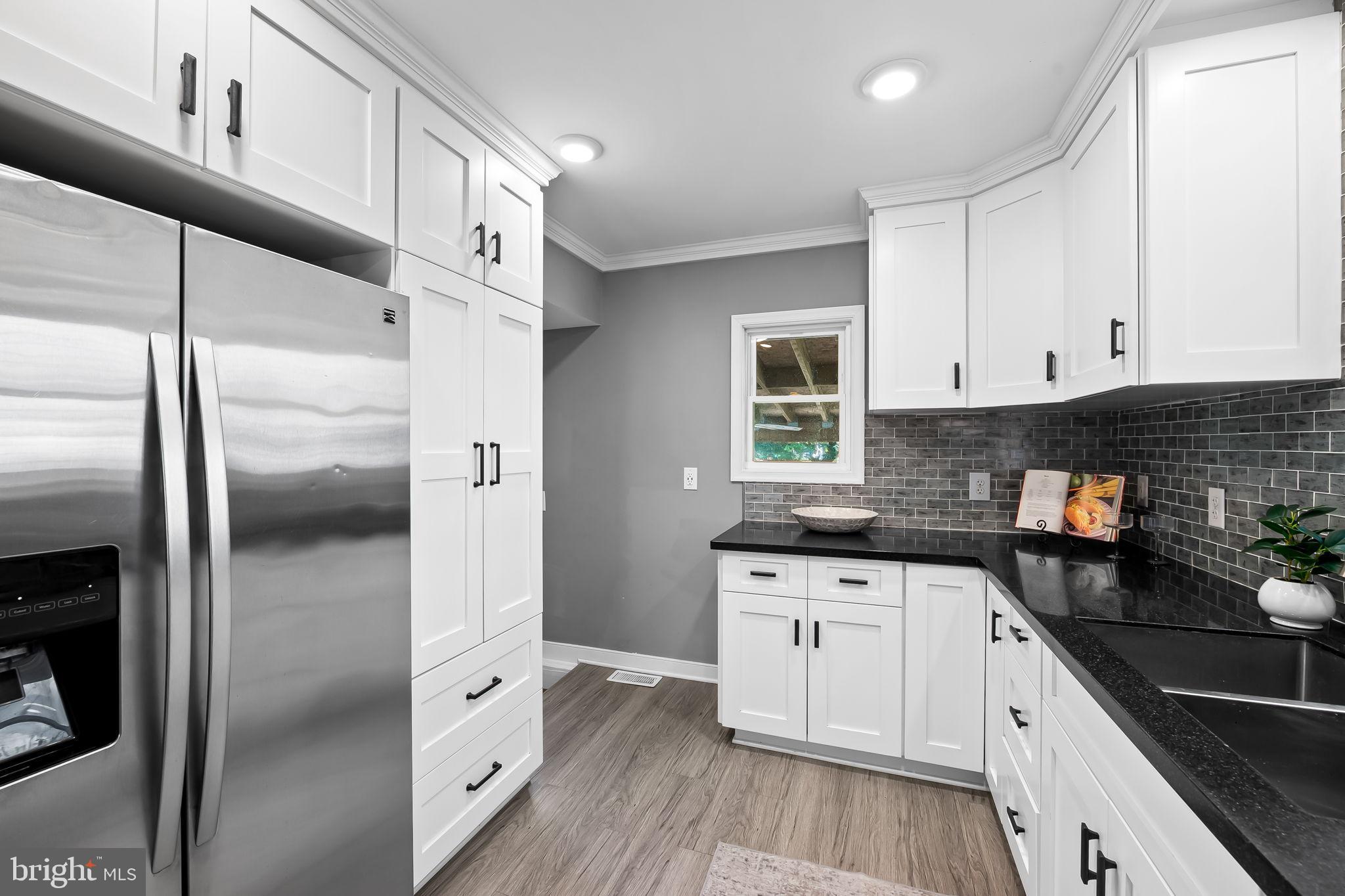 3332 Dublin Road Darlington, MD 21034 - Photo 14 of 39 a kitchen with stainless steel appliances a refrigerator sink and cabinets