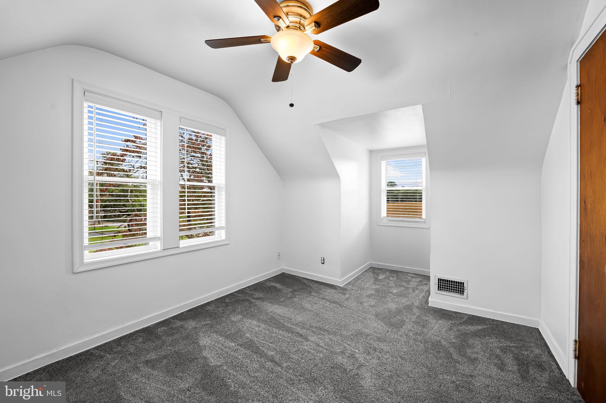 3332 Dublin Road Darlington, MD 21034 - Photo 24 of 39 an empty room with chandelier fan and windows