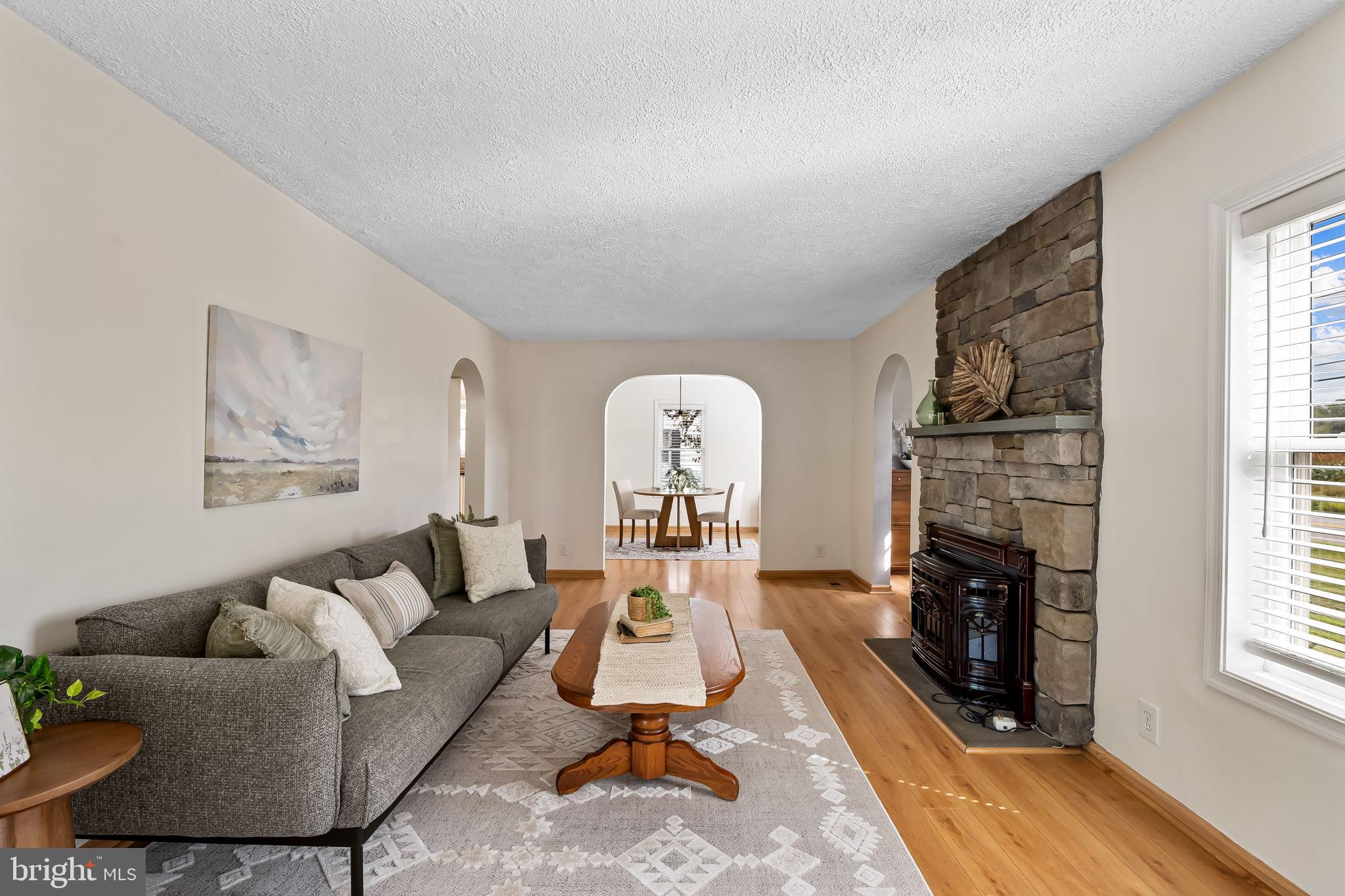 3332 Dublin Road Darlington, MD 21034 - Photo 7 of 39 a living room with furniture a fireplace and windows