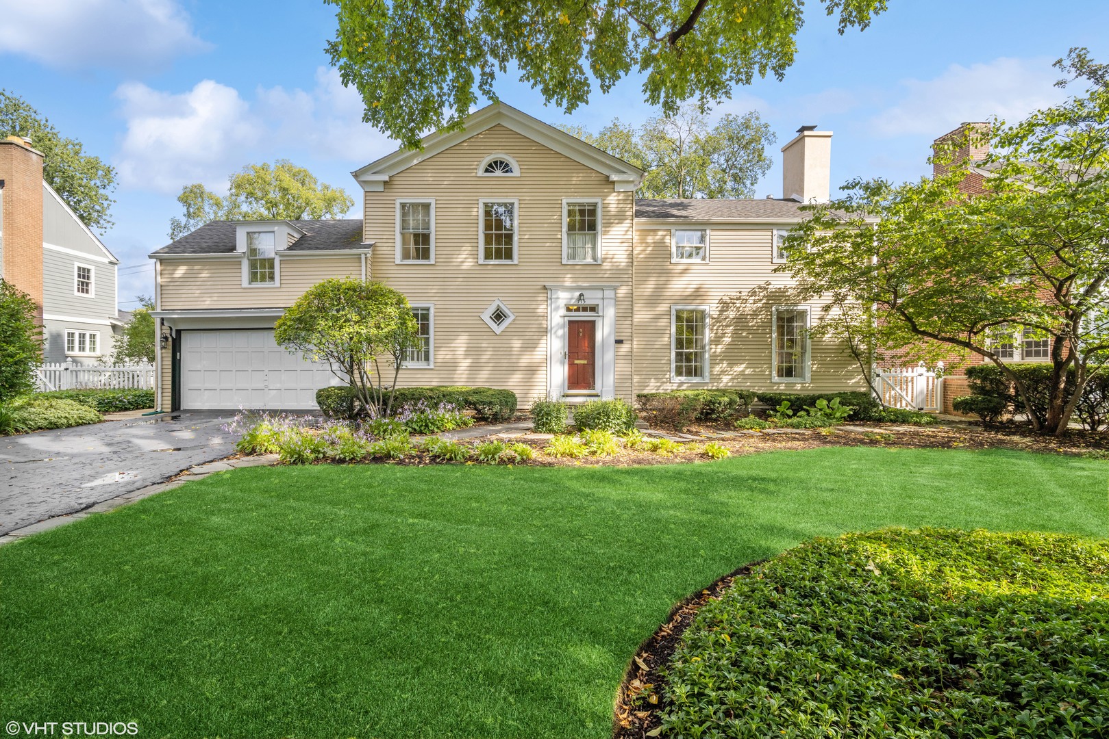 a front view of a house with a yard