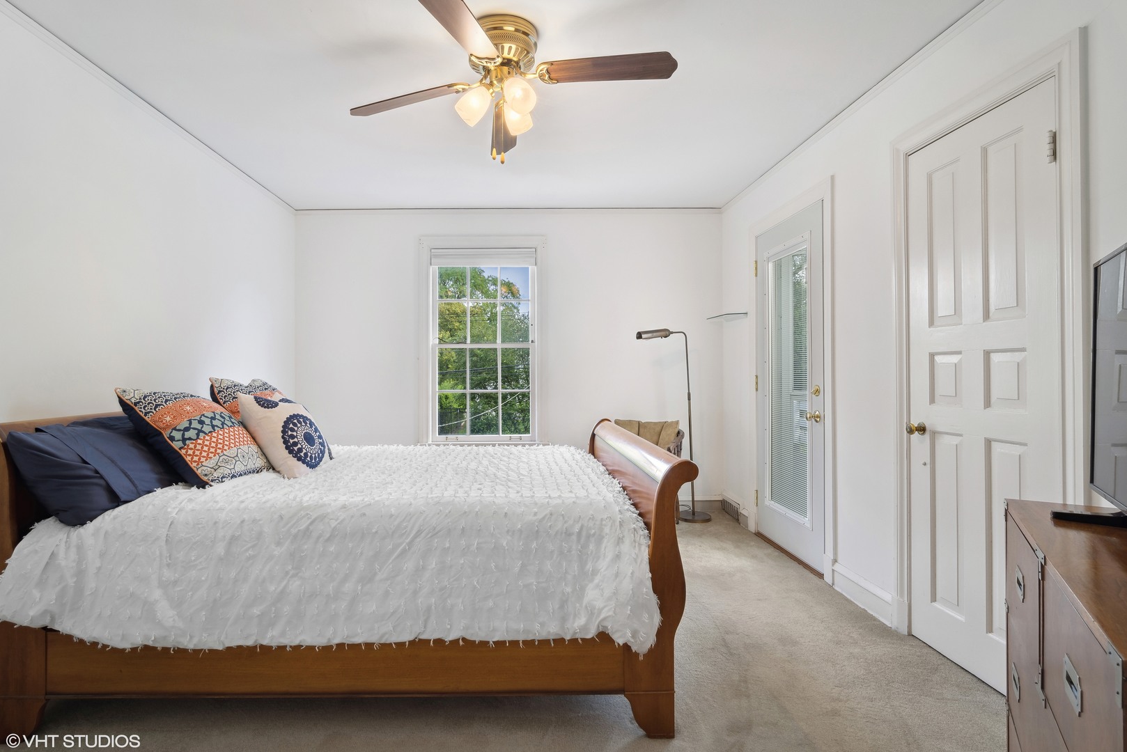 715 Wagner Road Glenview, IL 60025 - Photo 11 of 21 a bedroom with a bed and a chandelier