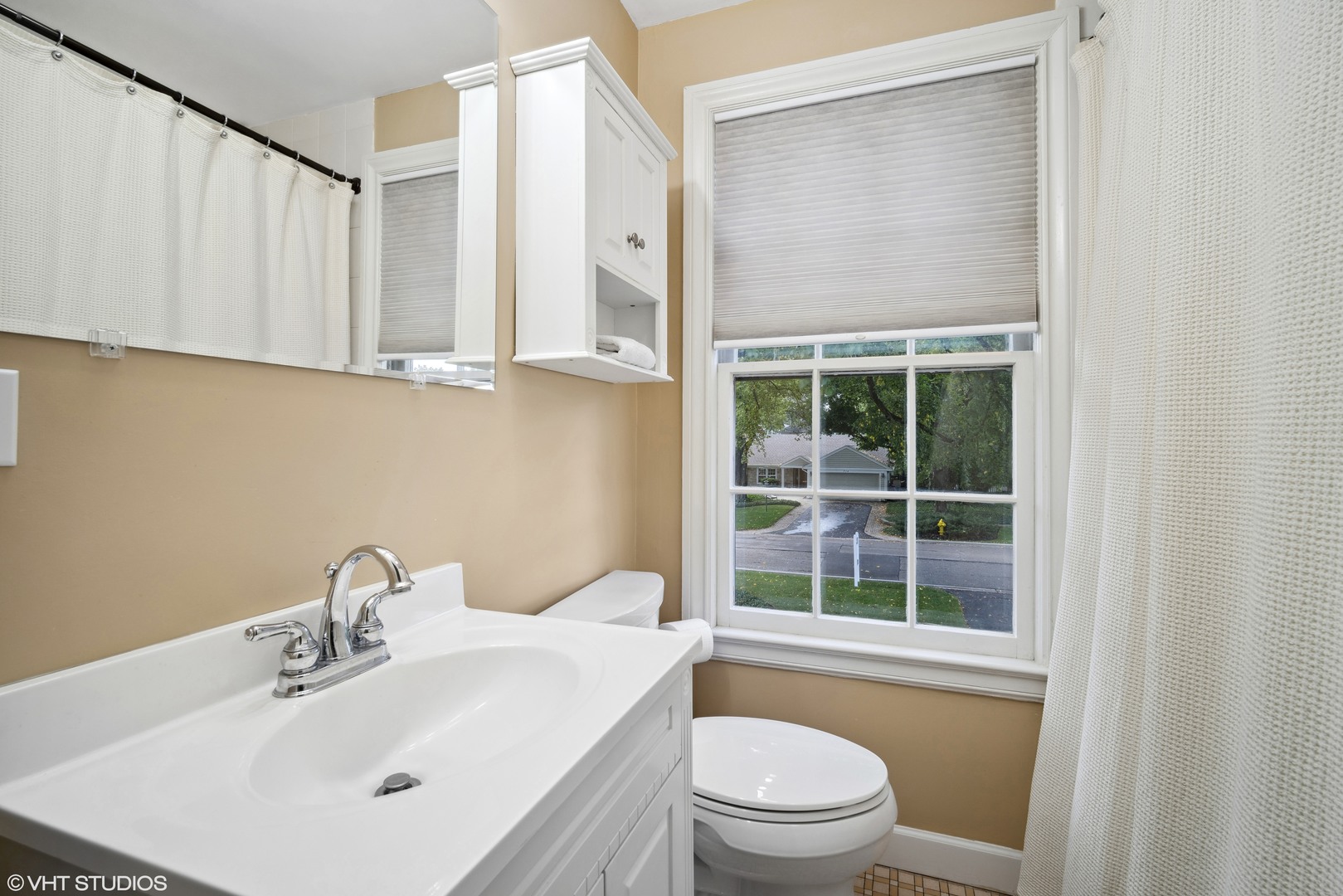 715 Wagner Road Glenview, IL 60025 - Photo 14 of 21 a bathroom with a sink a toilet and shower