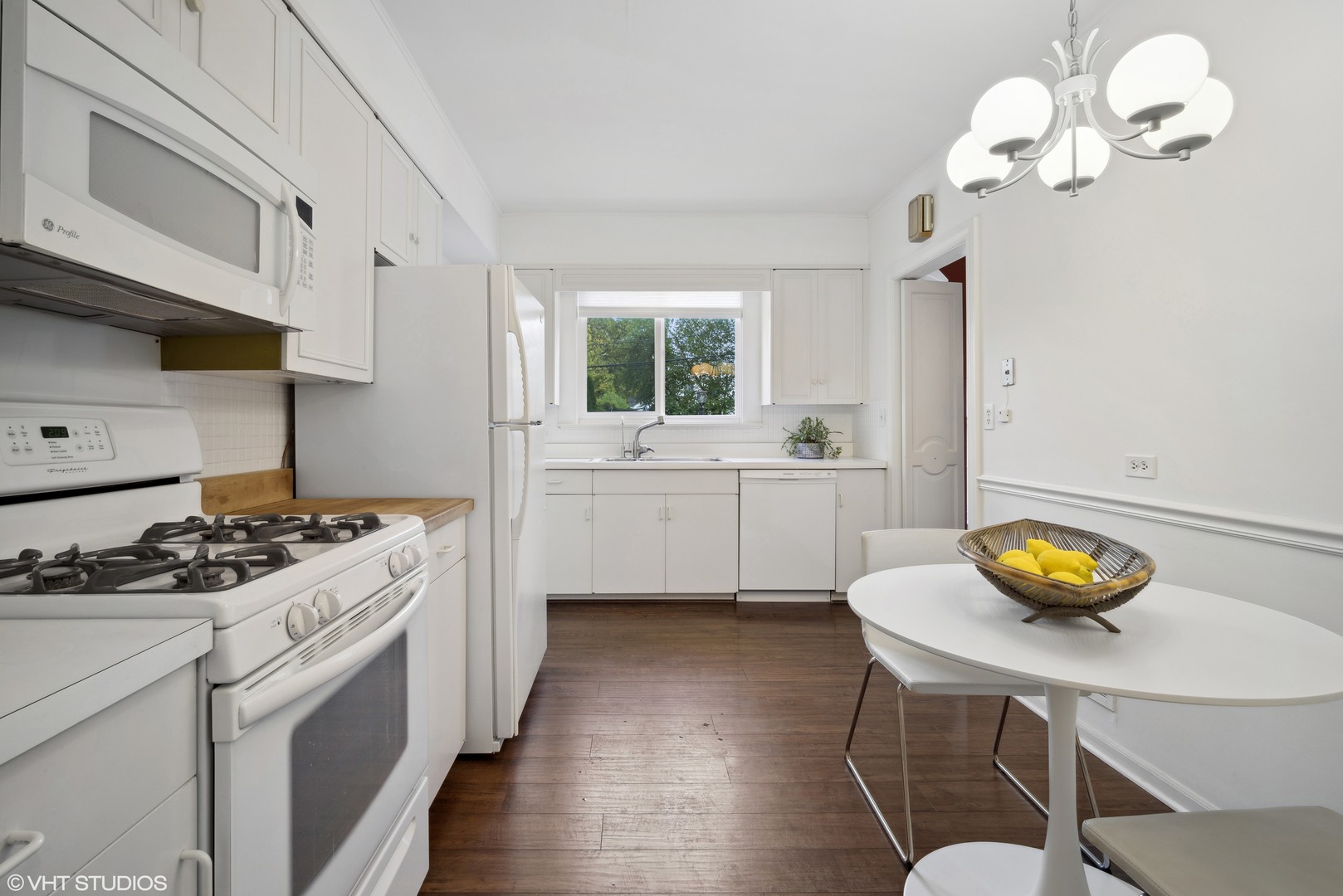 715 Wagner Road Glenview, IL 60025 - Photo 5 of 21 a kitchen that has a sink stainless steel appliances and window