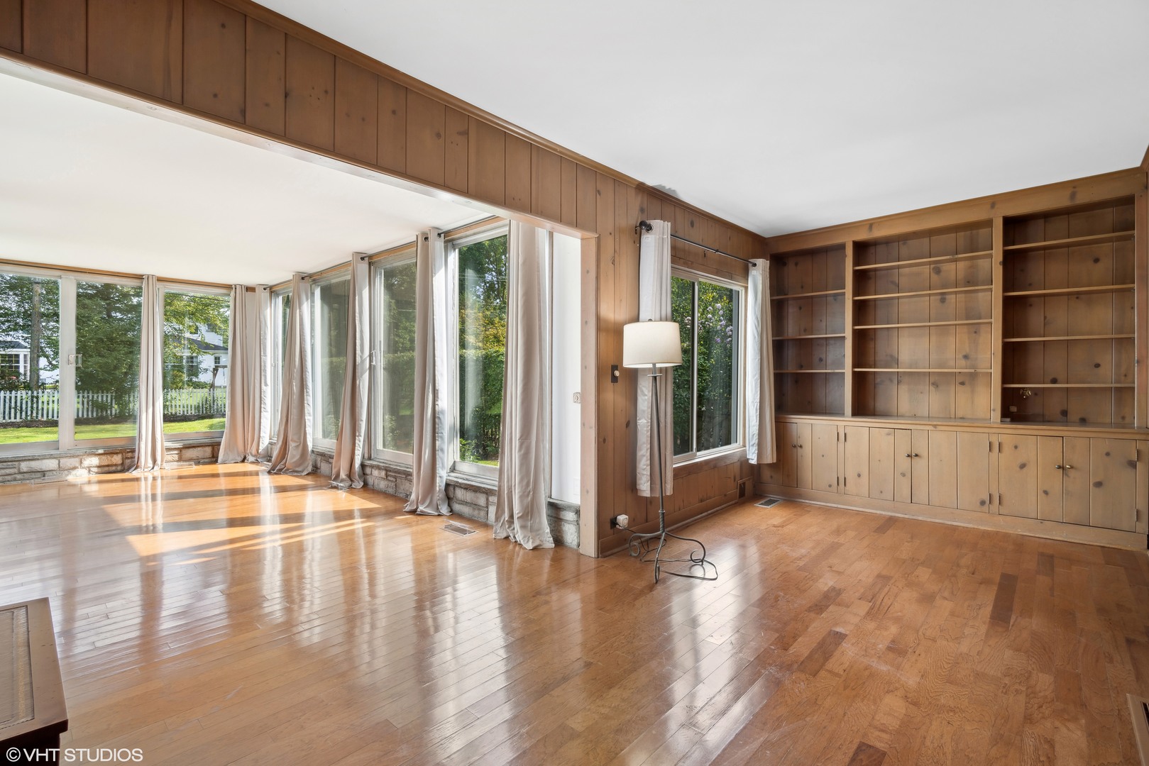 715 Wagner Road Glenview, IL 60025 - Photo 7 of 21 an empty room with wooden floor and windows