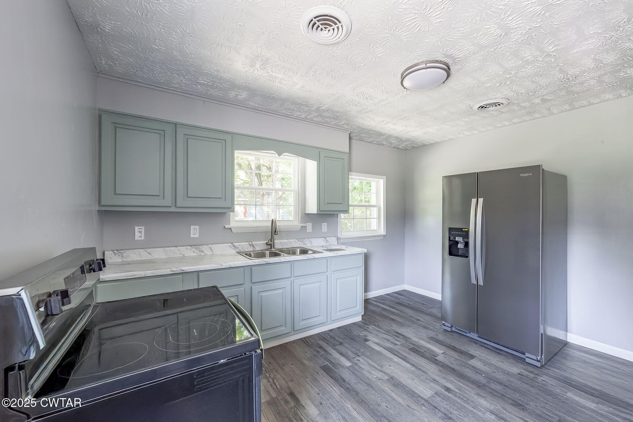 115 Neff Street Jackson, TN 38301 - Photo 12 of 23 a kitchen with a sink appliances and cabinets