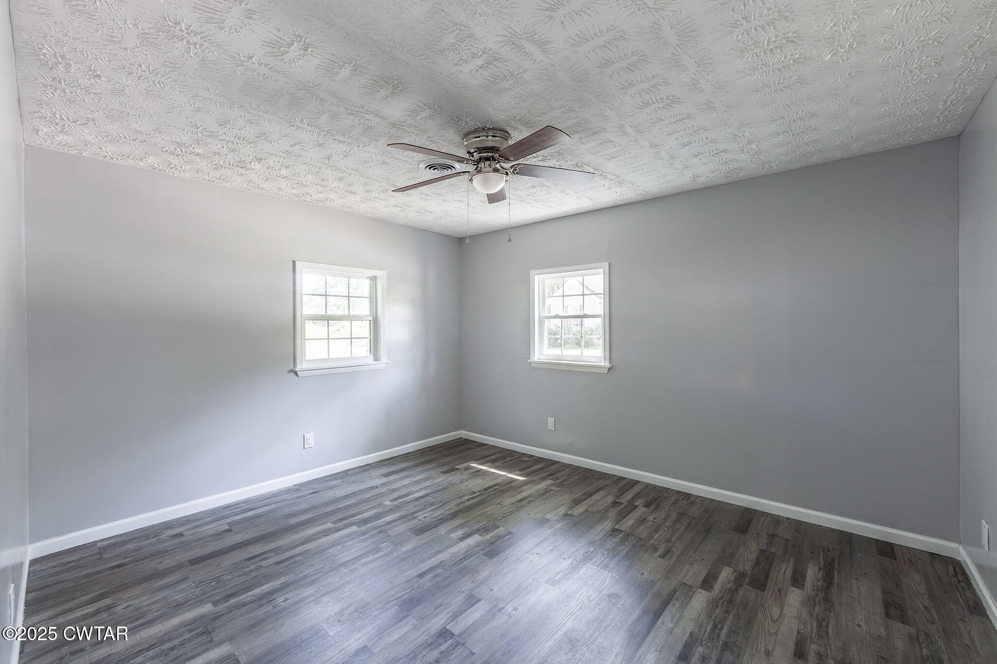 115 Neff Street Jackson, TN 38301 - Photo 15 of 23 wooden floor in an empty room with a window