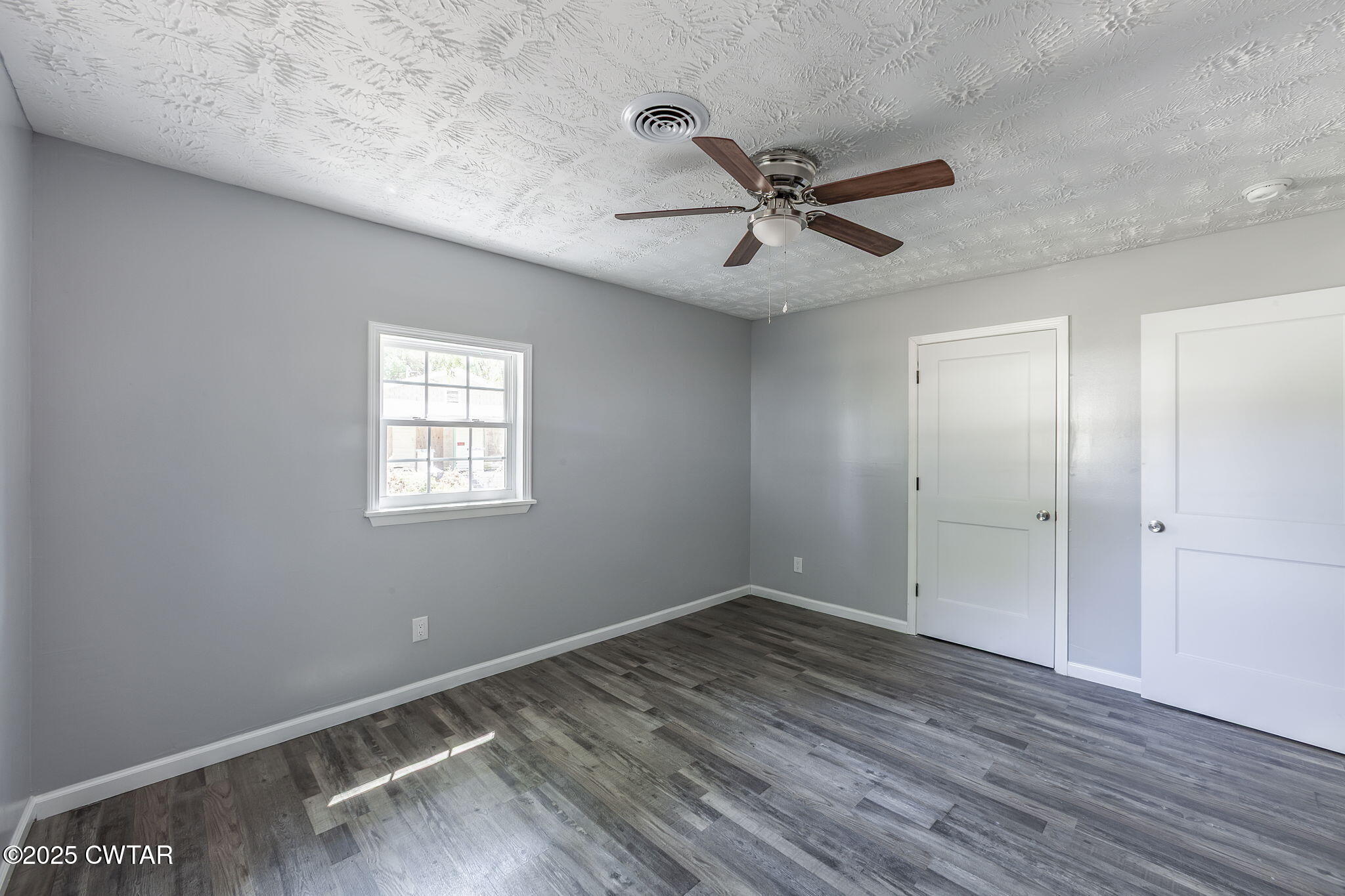 115 Neff Street Jackson, TN 38301 - Photo 17 of 23 a view of room with hardwood floor and ceiling fan