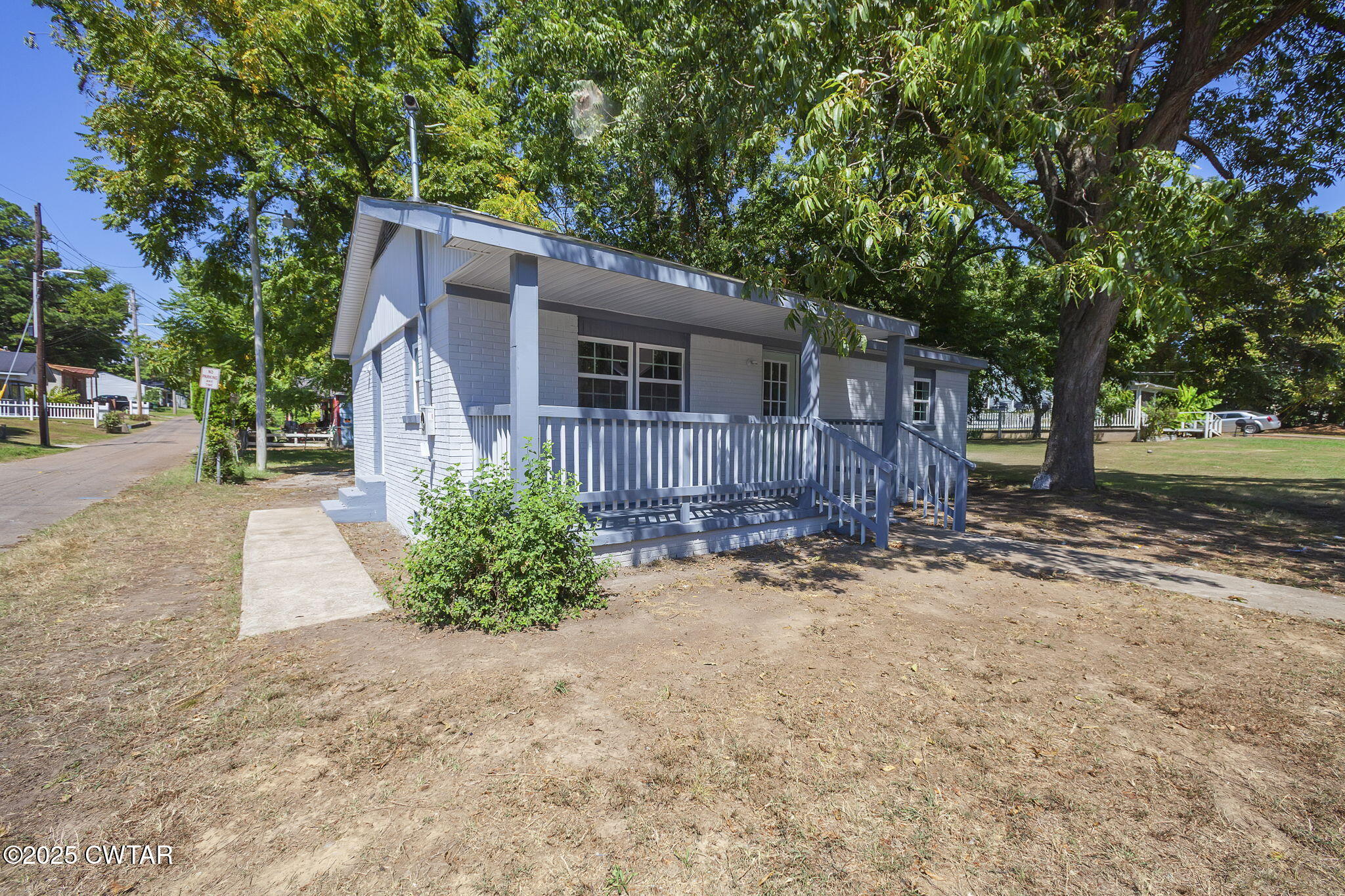 115 Neff Street Jackson, TN 38301 - Photo 2 of 23 a backyard of a house with barbeque oven and outdoor seating