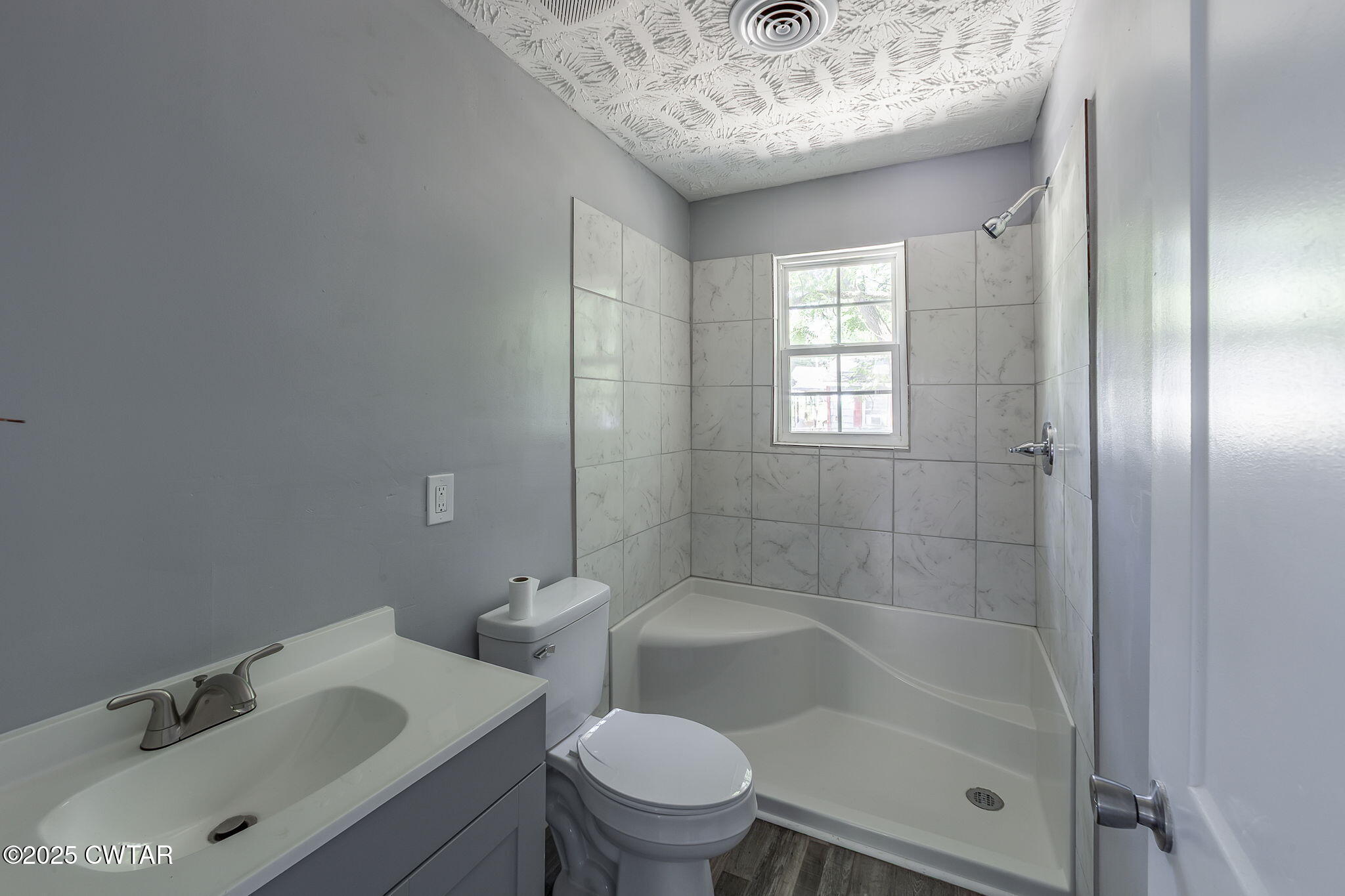 115 Neff Street Jackson, TN 38301 - Photo 21 of 23 a bathroom with a sink toilet and shower