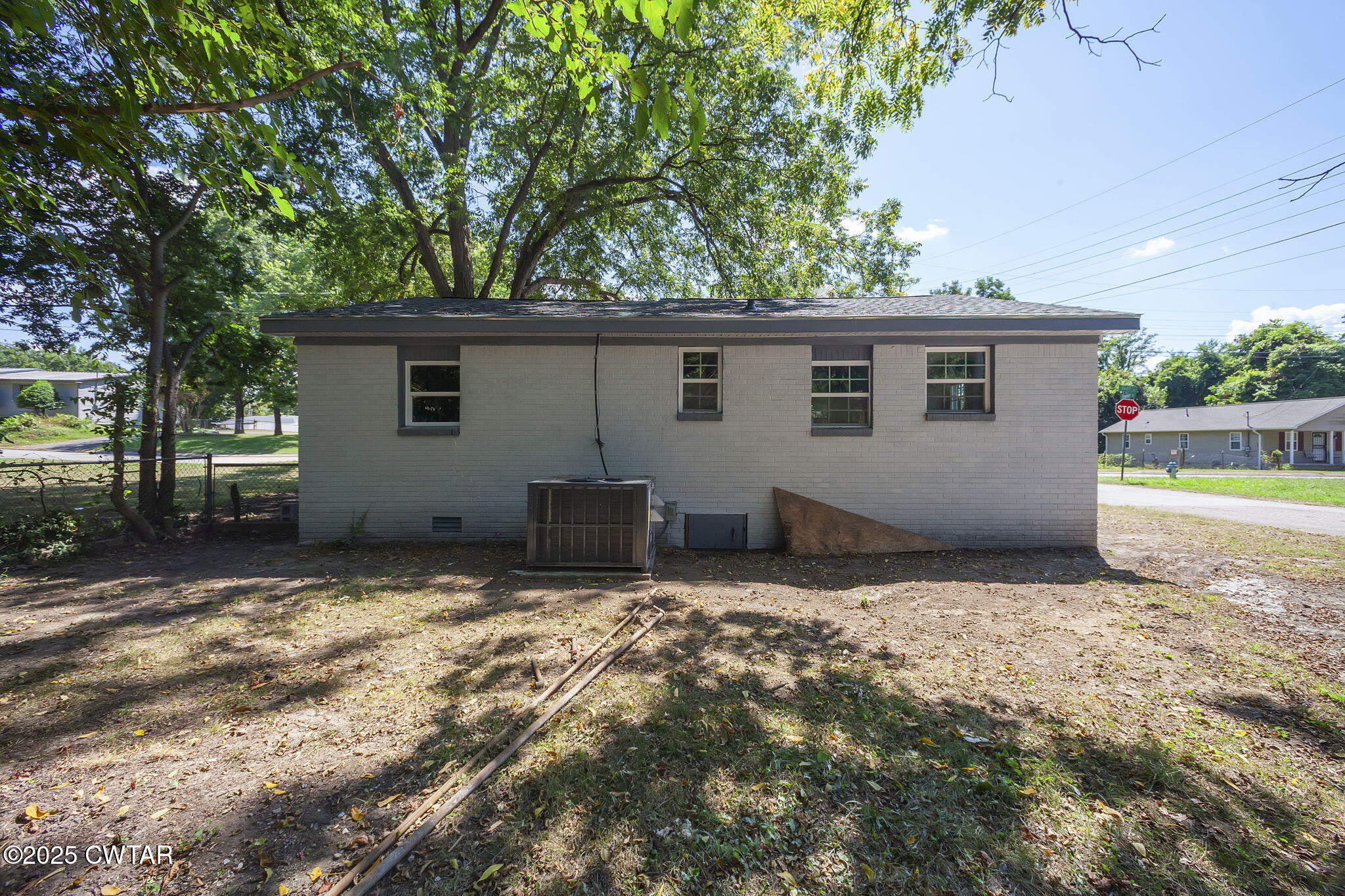 115 Neff Street Jackson, TN 38301 - Photo 4 of 23 a view of a house with backyard and a tree