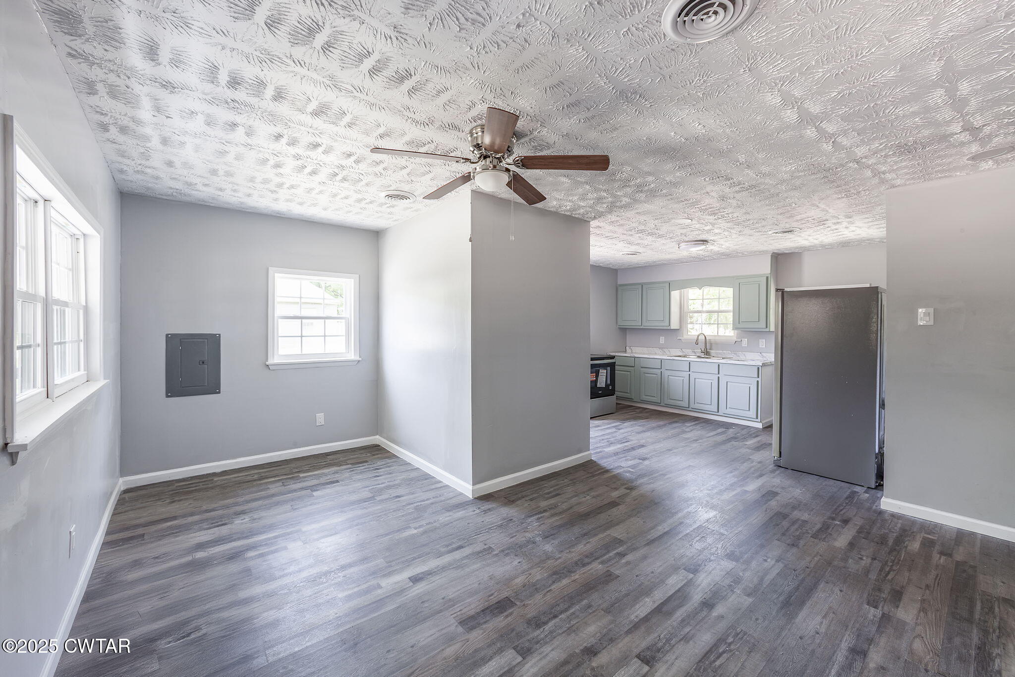 115 Neff Street Jackson, TN 38301 - Photo 7 of 23 wooden floor in an empty room with a window