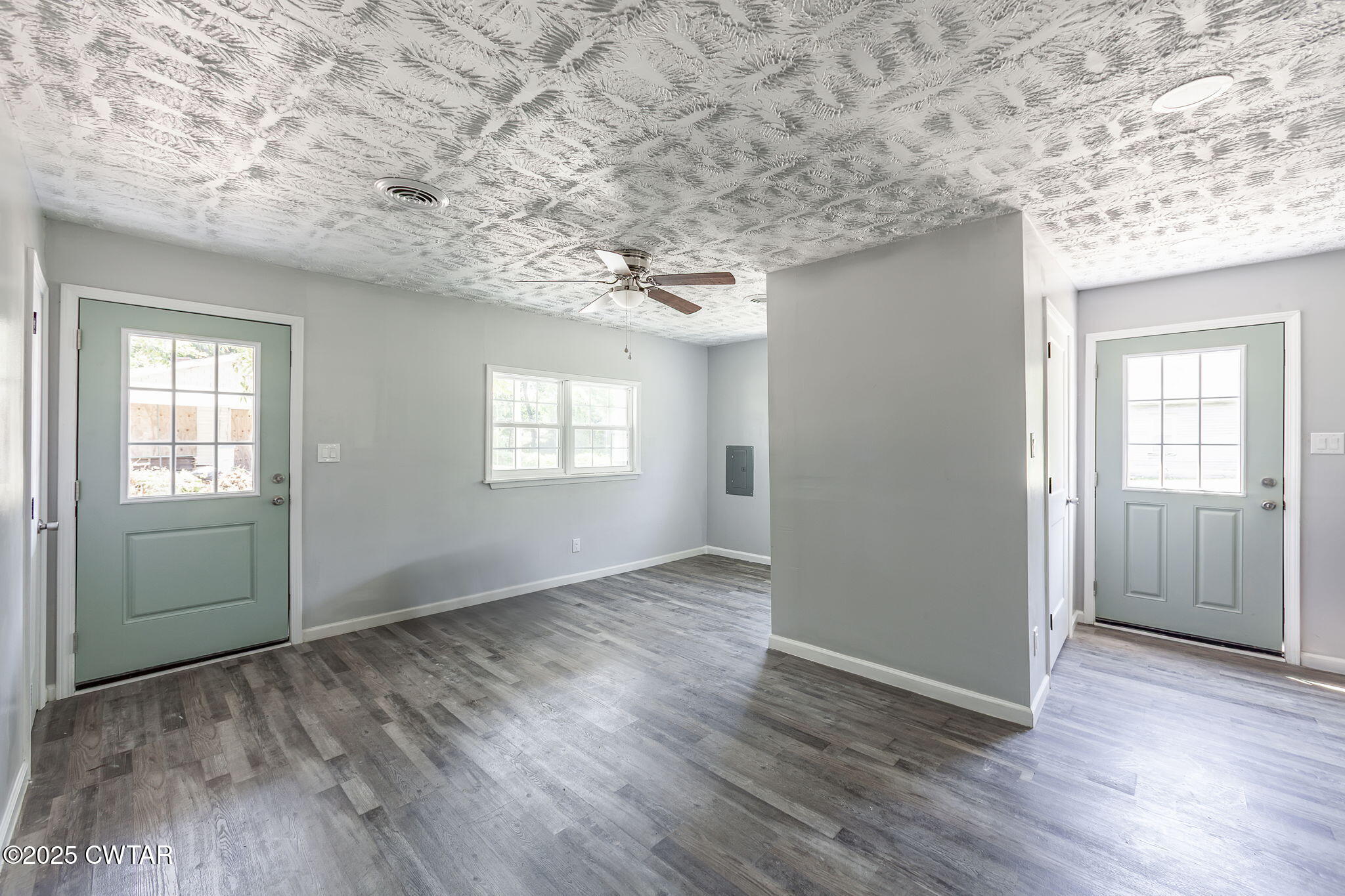 115 Neff Street Jackson, TN 38301 - Photo 9 of 23 an empty room with wooden floor and windows