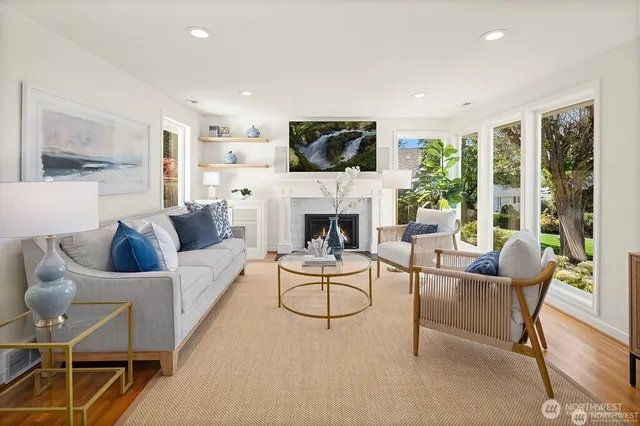 a living room with furniture fireplace and a flat screen tv