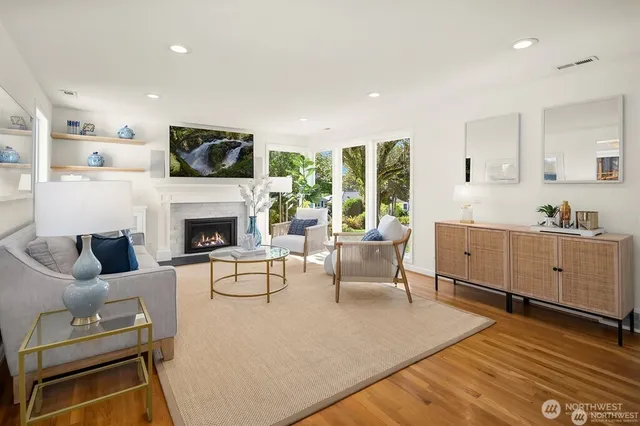 a living room with furniture fireplace and a flat screen tv