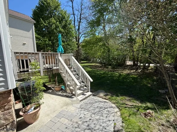 a view of balcony with wooden floor and outdoor seating