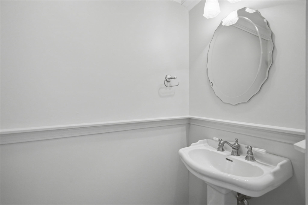 1155 Dickinson Street, Unit 1155 Springfield, MA 01108 - Photo 12 of 29 a bathroom with a sink and a mirror
