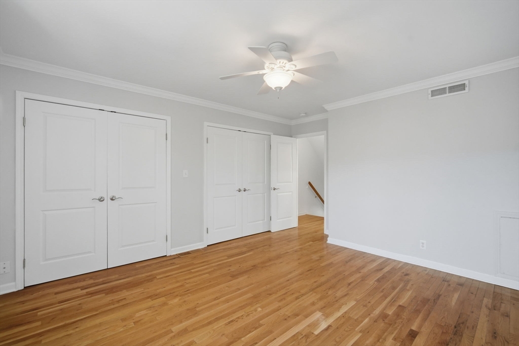 1155 Dickinson Street, Unit 1155 Springfield, MA 01108 - Photo 16 of 29 a view of an empty room with wooden floor