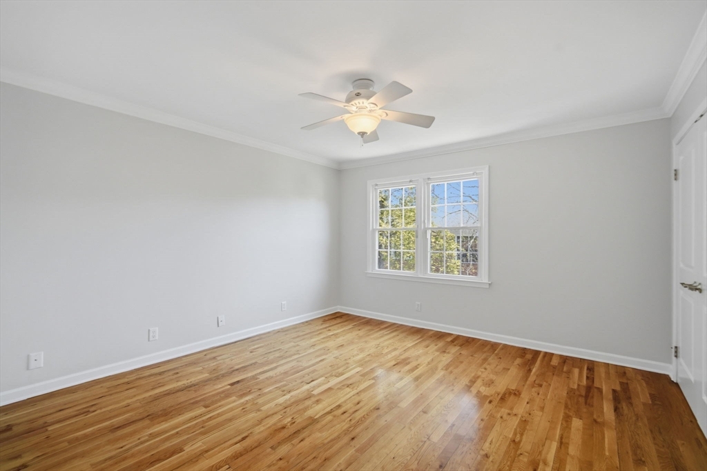 1155 Dickinson Street, Unit 1155 Springfield, MA 01108 - Photo 18 of 29 a view of an empty room with window and wooden floor