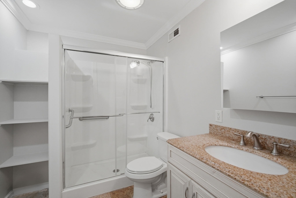 1155 Dickinson Street, Unit 1155 Springfield, MA 01108 - Photo 20 of 29 a bathroom with a granite countertop sink toilet mirror vanity and shower