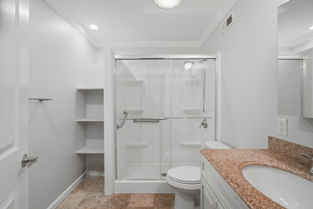 1155 Dickinson Street, Unit 1155 Springfield, MA 01108 - Photo 22 of 29 a bathroom with a granite countertop sink toilet and shower