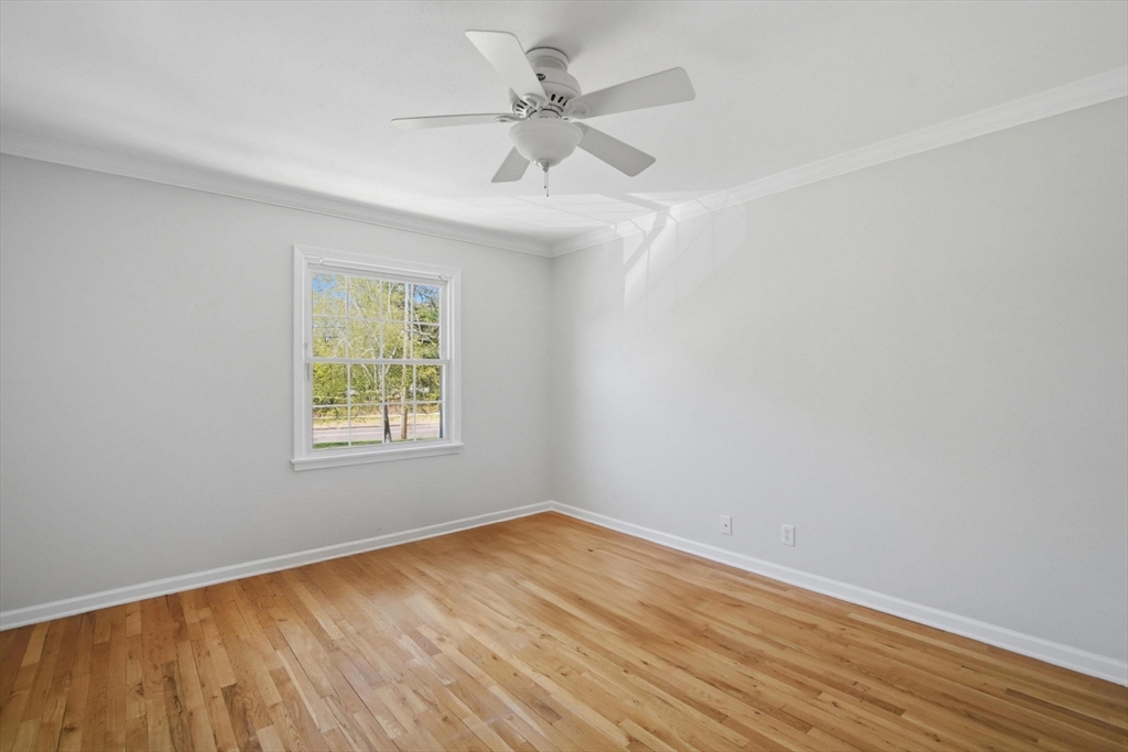 1155 Dickinson Street, Unit 1155 Springfield, MA 01108 - Photo 24 of 29 an empty room with a window and a fan