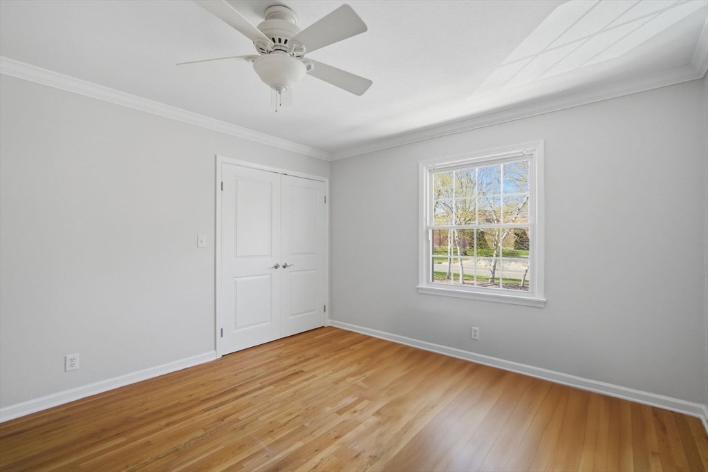 1155 Dickinson Street, Unit 1155 Springfield, MA 01108 - Photo 25 of 29 wooden floor in an empty room with a window