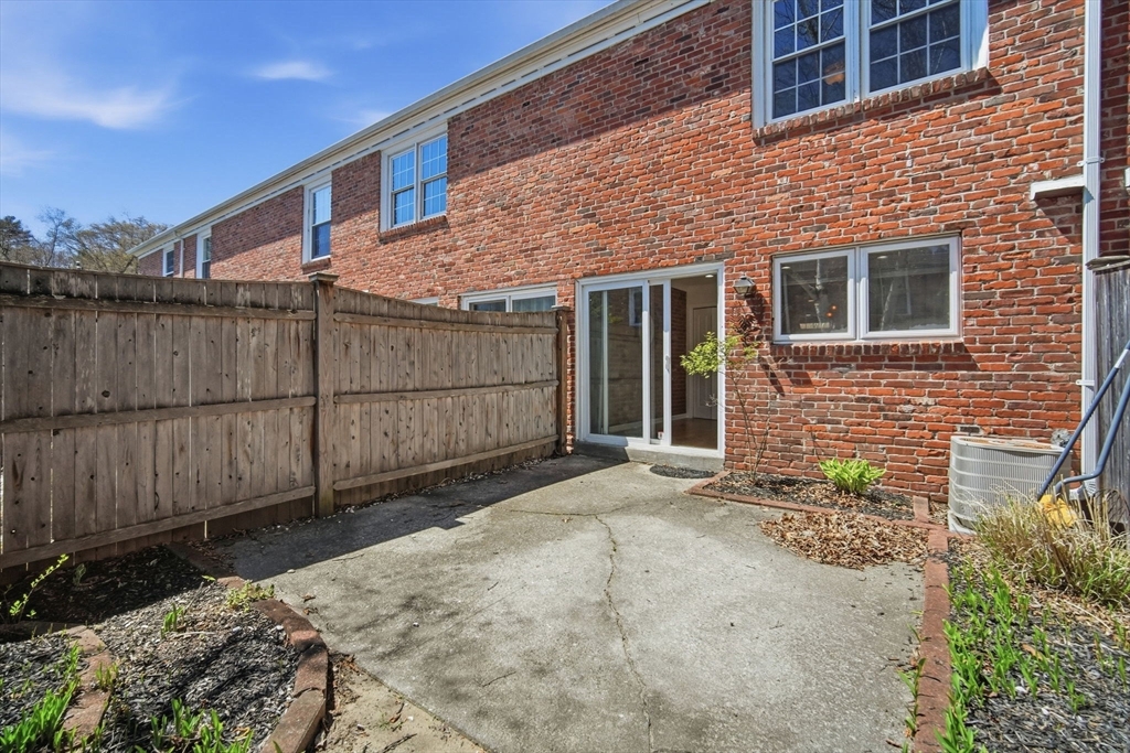 1155 Dickinson Street, Unit 1155 Springfield, MA 01108 - Photo 26 of 29 a backyard of a house with lots of green space