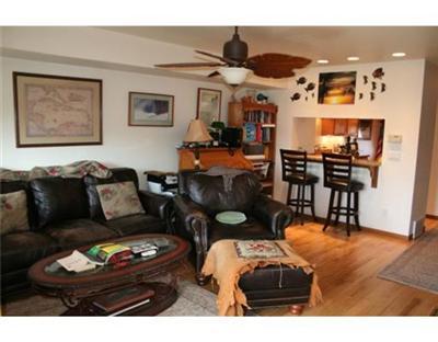 460 Moonridge Drive, Unit E2 Edwards, CO 81632 - Photo 2 of 12 a living room with furniture and wooden floor