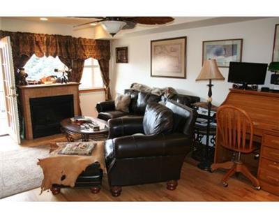 460 Moonridge Drive, Unit E2 Edwards, CO 81632 - Photo 3 of 12 a living room with furniture a window and a fireplace