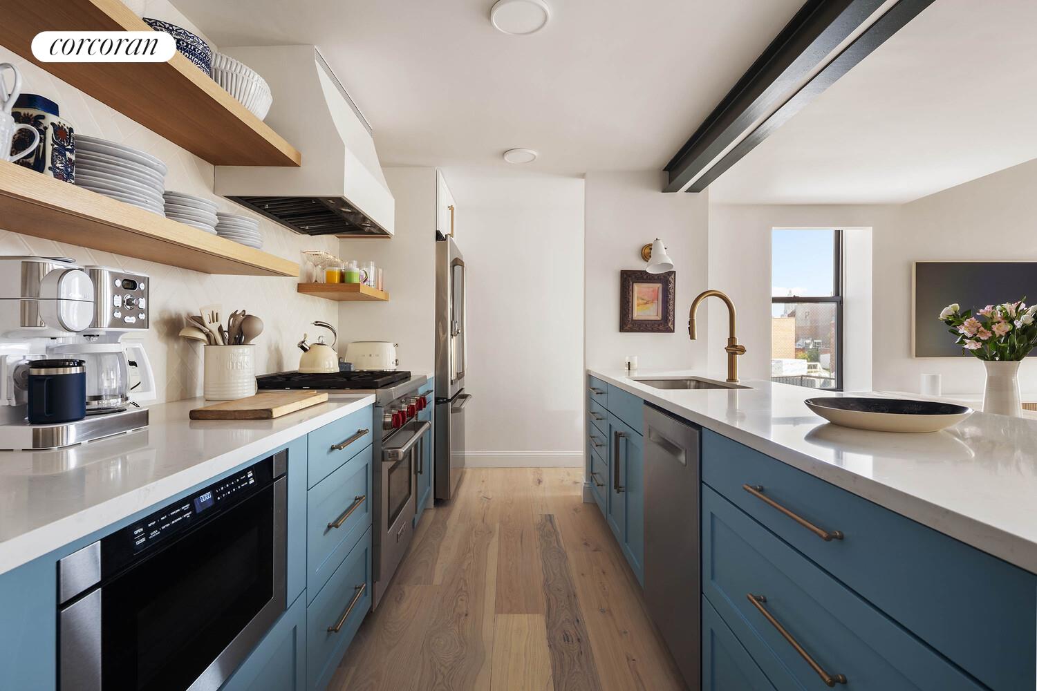 35 Bethune Street, Unit PHB Manhattan, NY 10014 - Photo 3 of 13 a large kitchen with stainless steel appliances granite countertop a lot of counter space and wooden floors