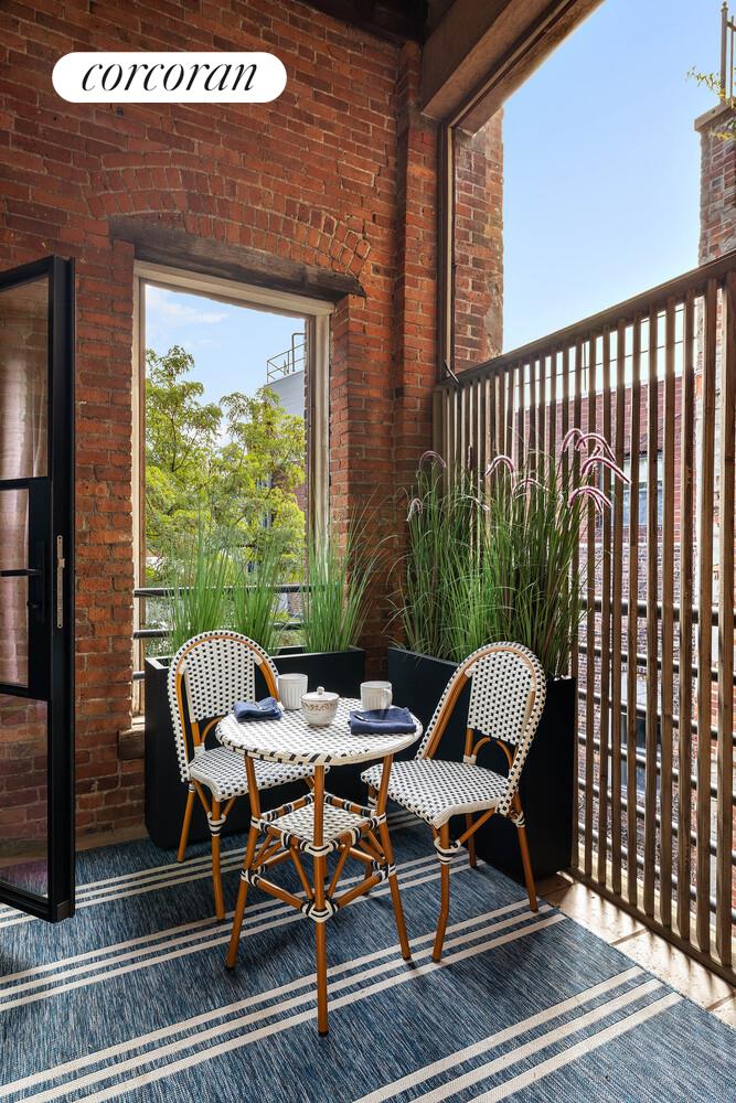 35 Bethune Street, Unit PHB Manhattan, NY 10014 - Photo 5 of 13 a patio with glass windows and furniture