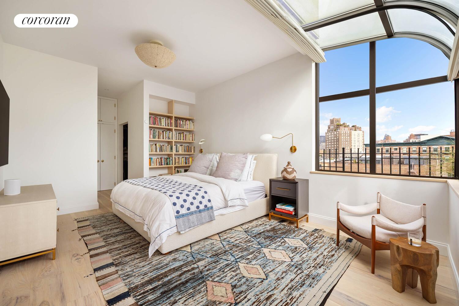 35 Bethune Street, Unit PHB Manhattan, NY 10014 - Photo 7 of 13 a bedroom with a large bed and a window