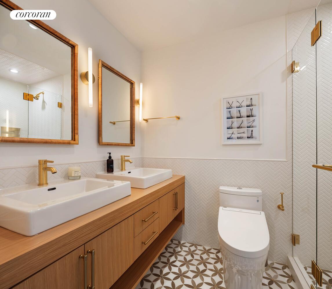 35 Bethune Street, Unit PHB Manhattan, NY 10014 - Photo 8 of 13 a bathroom with a toilet sink and mirror