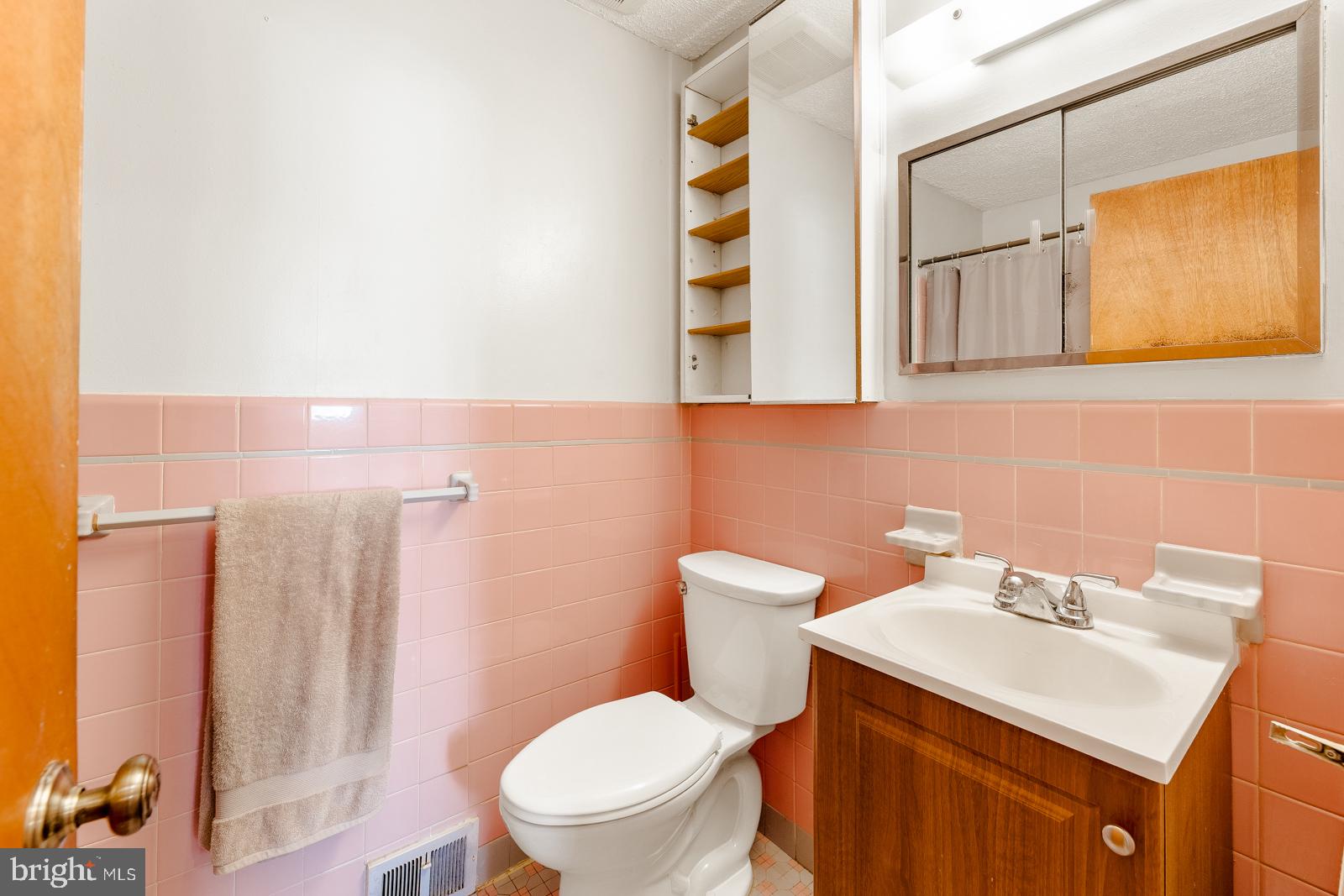 823 Rennard Street Philadelphia, PA 19116 - Photo 26 of 40 Charming retro bathroom with pink tiles.