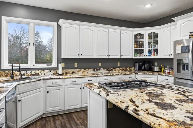 a view of staircase with rug