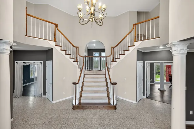 a view of hall way with staircase