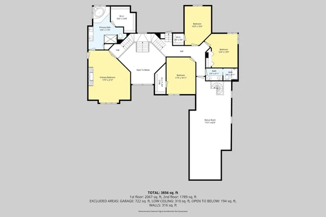 a view of a swimming pool with a yard and large tree