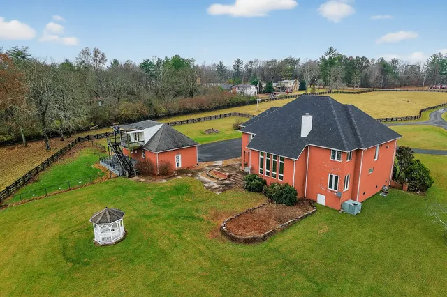 a view of a pool in a backyard