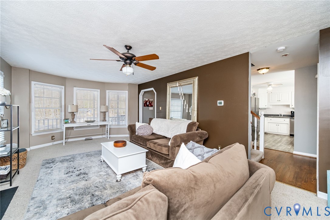 2423 Brookforest Road Midlothian, VA 23112 - Photo 12 of 40 a living room with furniture and a large window