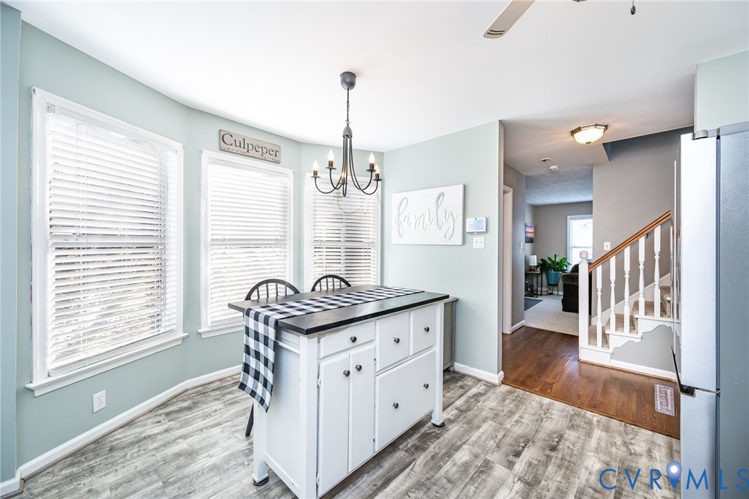 2423 Brookforest Road Midlothian, VA 23112 - Photo 19 of 40 a kitchen with granite countertop a stove a sink and a window