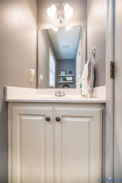 2423 Brookforest Road Midlothian, VA 23112 - Photo 21 of 40 a bathroom with a sink vanity and a mirror