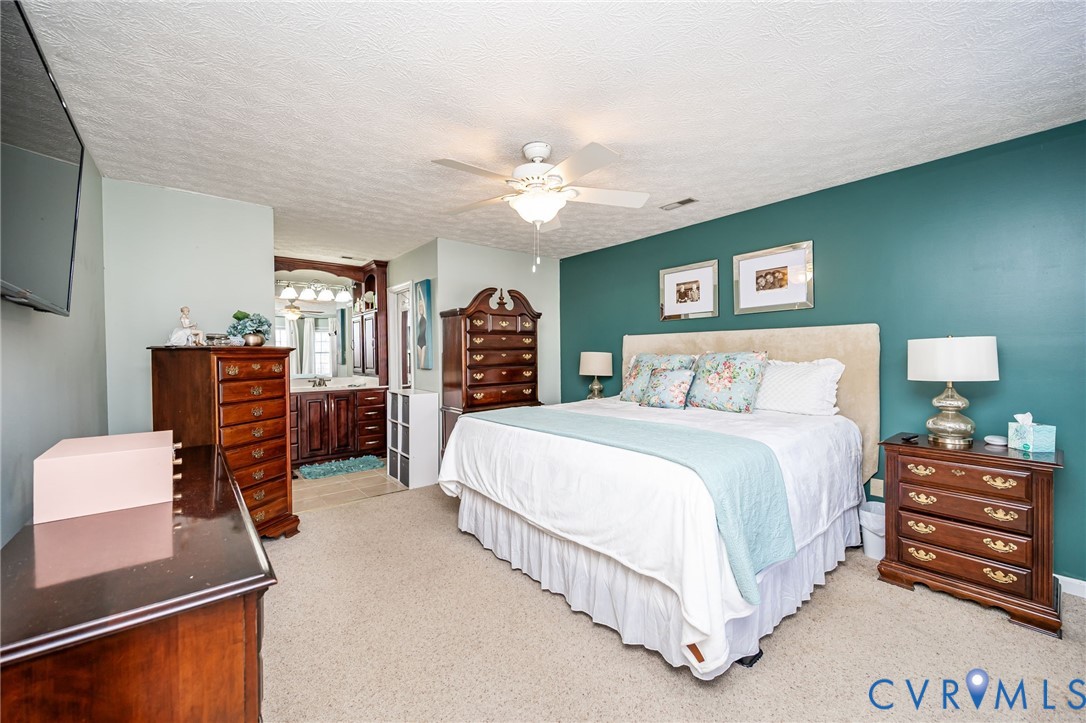 2423 Brookforest Road Midlothian, VA 23112 - Photo 23 of 40 a bedroom with a bed and furniture