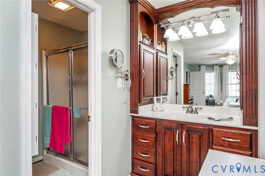2423 Brookforest Road Midlothian, VA 23112 - Photo 26 of 40 a bathroom with a sink vanity and a mirror