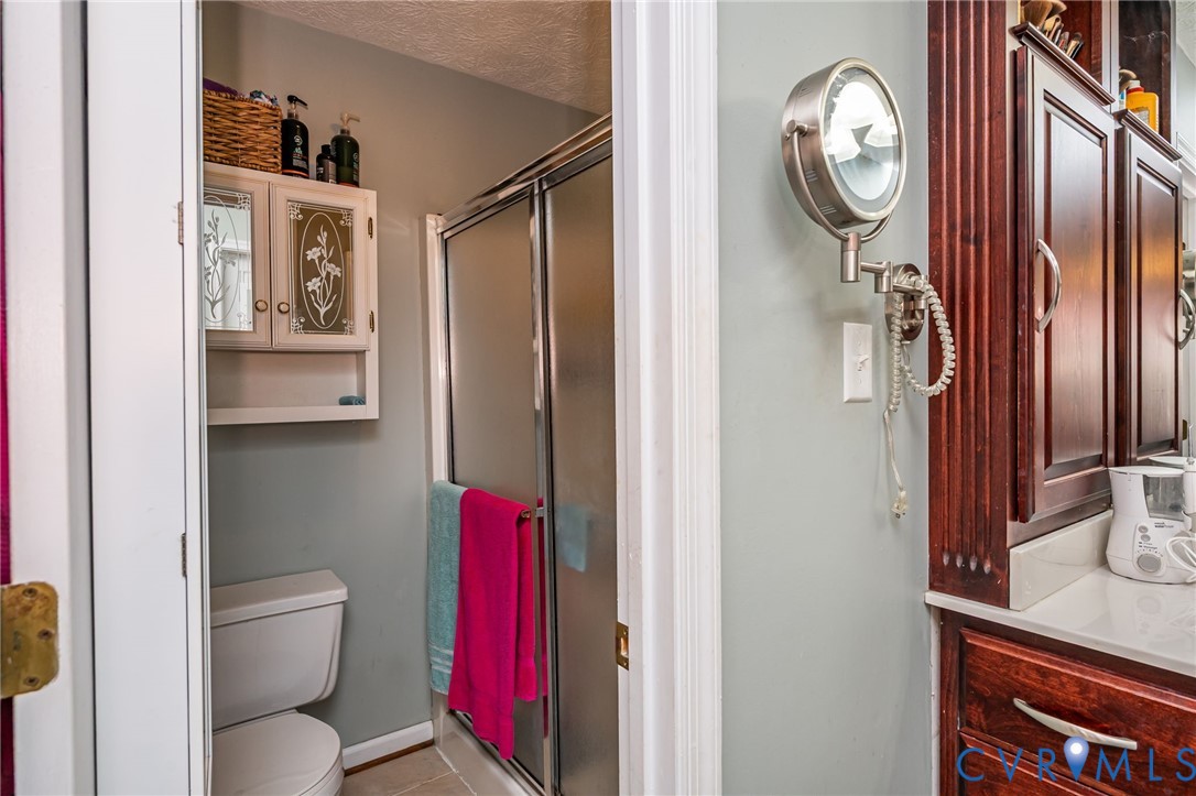 2423 Brookforest Road Midlothian, VA 23112 - Photo 27 of 40 a bathroom with a toilet and a mirror