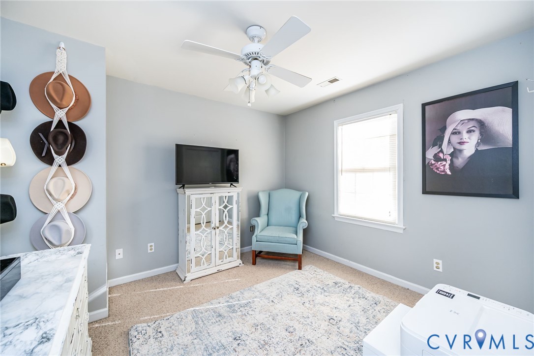 2423 Brookforest Road Midlothian, VA 23112 - Photo 30 of 40 a bedroom with a bed and a window