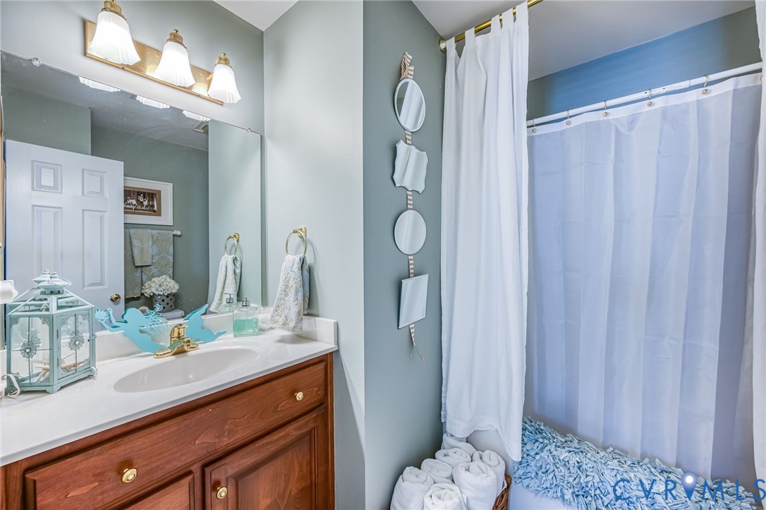 2423 Brookforest Road Midlothian, VA 23112 - Photo 32 of 40 a bathroom with a granite countertop sink and a mirror