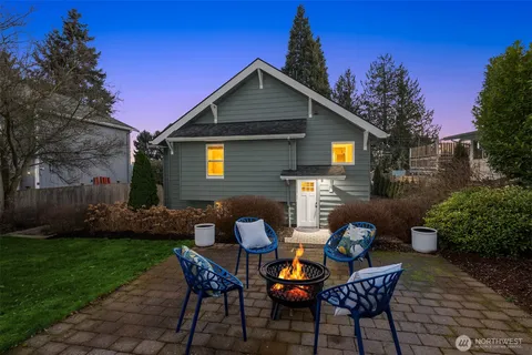 a view of a backyard with large trees