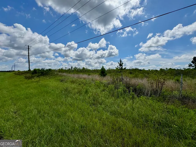 a view of a lake with a yard